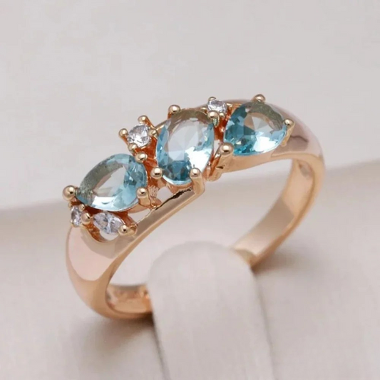 Gold ring with blue zirconia